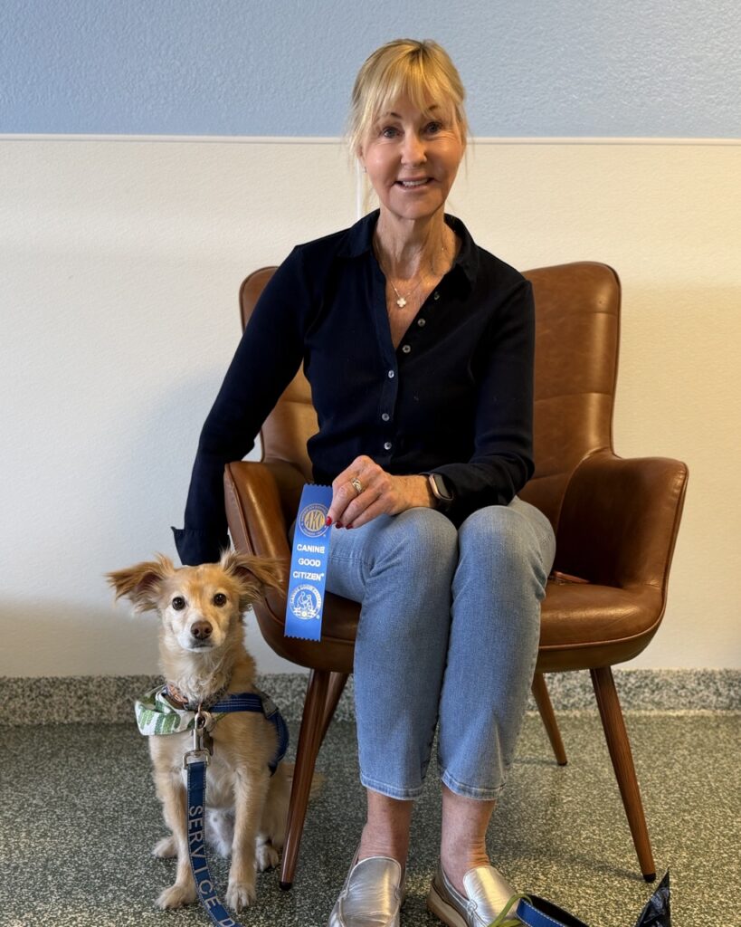 Kathy Pigeon, #LovePup Foundation Board Member, with a service dog