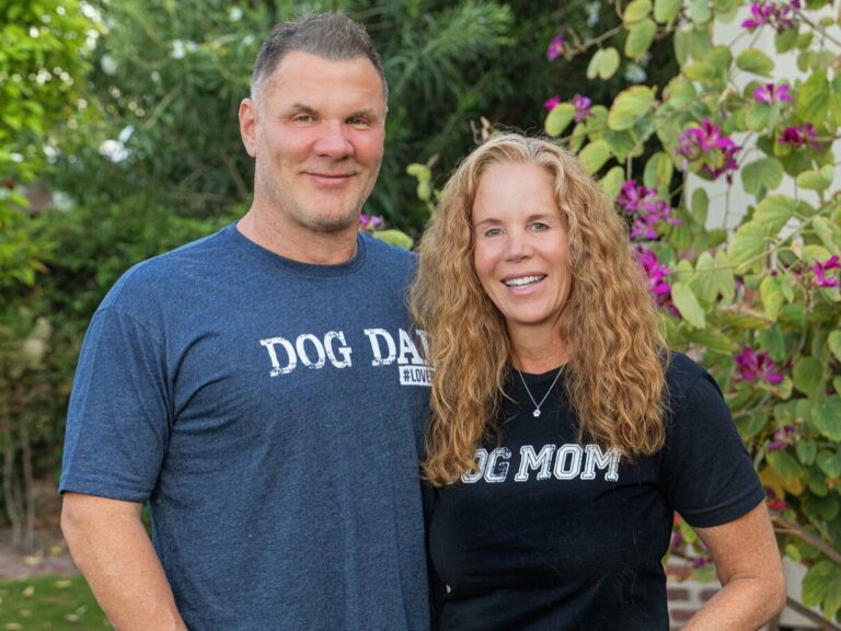 Blake and Johnjay "JJ" Van Es, co-founders of the #LovePup Foundation, wearing Dog Mom and Dog Dad shirts